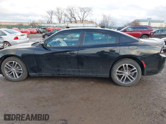 2019 Dodge Charger SXT with VIN 2C3CDXJG3KH630975, listed as a IAAI auction lot 41580174 with 74,575 mi miles and . Bid and sale history available at DreamBid. Image 14.