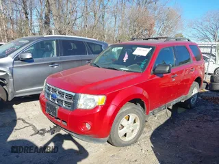 2011 Ford Escape XLT with VIN 1FMCU0D76BKB89698, listed as a IAAI auction lot 41073661 with 124,479 mi miles. Bid and sale history available at carsss.com. Image 2.