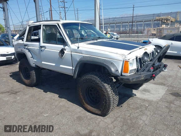 1991 Jeep Cherokee Country z VIN 1J4FJ78S7ML632675, wystawiony jako IAAI lot #42283175 z przebiegiem 116 062 mil mil oraz . Historia ofert i sprzedaży dostępna na DreamBid. Obrazek 1.