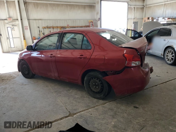2009 Toyota Yaris with VIN JTDBT903891313898, listed as a Copart auction lot 87820085 with 212,806 mi miles and Salvage Title. Bid and sale history available at carsss.com. Image 2.