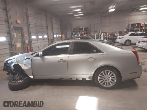 2012 Cadillac CTS Premium z VIN 1G6DS5E33C0139591, wystawiony jako IAAI lot #41985026 z przebiegiem 151 810 mil mil oraz . Historia ofert i sprzedaży dostępna na DreamBid. Obrazek 14.