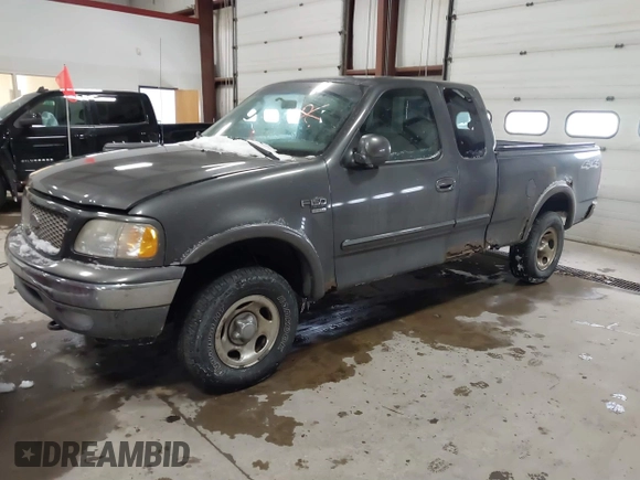 2003 Ford F-150 XL with VIN 1FTRX18W63NB69173, listed as a IAAI auction lot 41618645 with 219,506 mi miles. Bid and sale history available at carsss.com. Image 2.