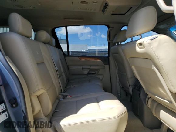 2008 Infiniti QX56 z VIN 5N3AA08D18N900593, wystawiony jako Copart lot #52088985 z przebiegiem 171 572 mil mil oraz Szkoda całkowita • Salvage title. Historia ofert i sprzedaży dostępna na DreamBid. Obrazek 11.