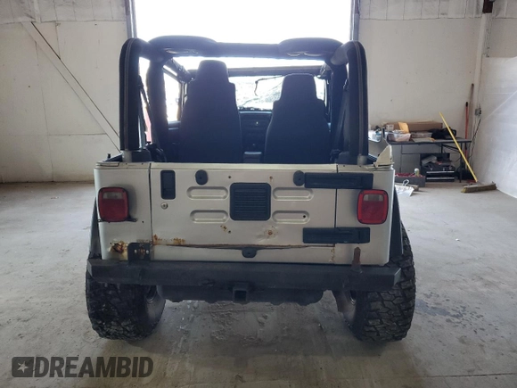 2006 Jeep Wrangler Rubicon with VIN 1J4FA69S26P734731, listed as a Copart auction lot 52009295 with 117,872 mi miles and Salvage title. Bid and sale history available at DreamBid. Image 6.