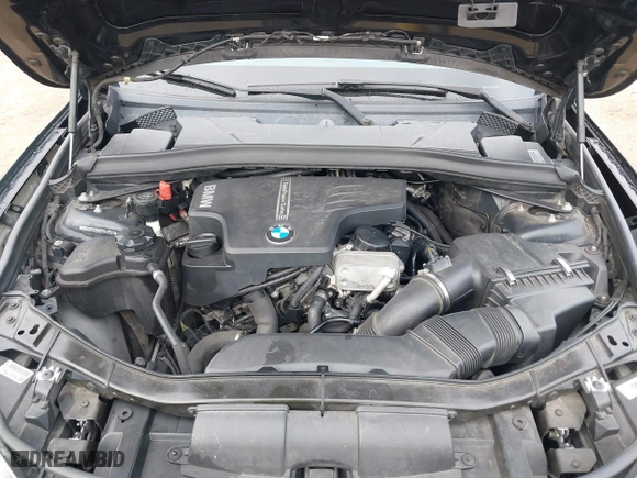 2014 BMW X1 sDrive28i with VIN WBAVM1C54EVW46561, listed as a IAAI auction lot 41880387 with 125,096 mi miles. Bid and sale history available at carsss.com. Image 10.