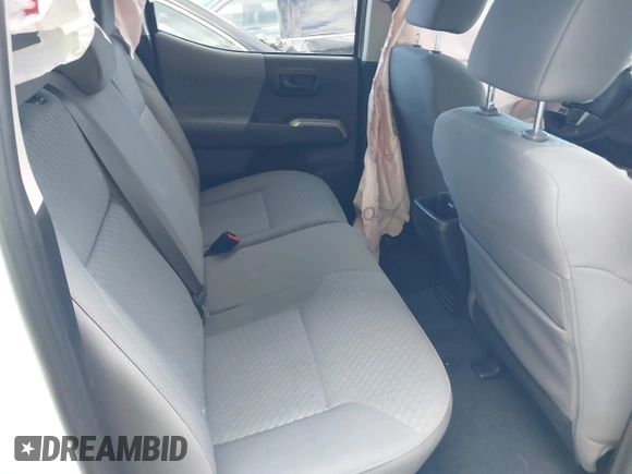 2023 Toyota Tacoma SR5 z VIN 3TYAZ5CN6PT039427, wystawiony jako IAAI lot #40866490 z przebiegiem 18 481 mil mil oraz . Historia ofert i sprzedaży dostępna na DreamBid. Obrazek 8.