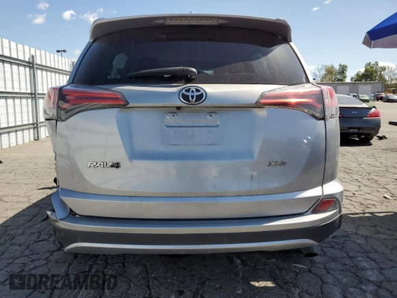 2018 Toyota RAV4 XLE with VIN 2T3WFREV6JW411336, listed as a Copart auction lot 51281735 with 150,862 mi miles and Salvage Title. Bid and sale history available at DreamBid. Image 6.