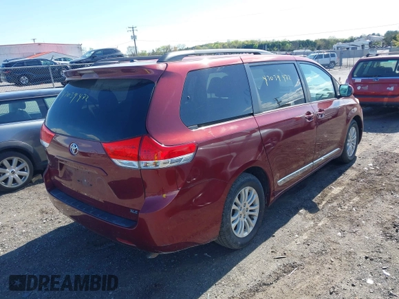 2014 Toyota Sienna XLE with VIN 5TDYK3DC8ES457940, listed as a IAAI auction lot 42039472 with 99,769 mi miles and . Bid and sale history available at DreamBid. Image 4.