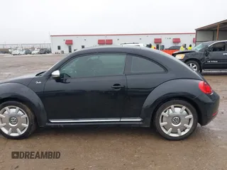 2013 Volkswagen Beetle 2.5L w/Sun/Sound/Nav with VIN 3VWJX7AT1DM686146, listed as a IAAI auction lot 41444277 with 92,964 mi miles and . Bid and sale history available at DreamBid. Image 14.