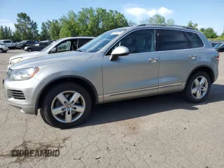 2012 Volkswagen Touareg z VIN WVGEG9BP6CD008533, wystawiony jako Copart lot #60356345 z przebiegiem 103 270 mil mil oraz Czysty tytuł • Clean title. Historia ofert i sprzedaży dostępna na DreamBid. Obrazek 1.