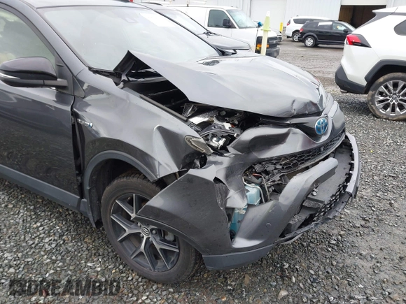 2018 Toyota RAV4 Hybrid SE with VIN JTMJJREV7JD208249, listed as a IAAI auction lot 41859301 with 91,899 mi miles and . Bid and sale history available at DreamBid. Image 6.