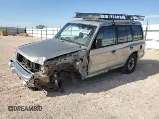 1998 Mitsubishi Montero z VIN JA4MR51R0WJ000921, wystawiony jako Copart lot #56250965 z przebiegiem 181 293 mil mil oraz Szkoda całkowita • Salvage title. Historia ofert i sprzedaży dostępna na DreamBid. Obrazek 1.