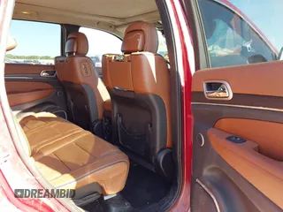 2015 Jeep Grand Cherokee Summit with VIN 1C4RJEJG9FC100568, listed as a IAAI auction lot 42512705 with 128,413 mi miles and . Bid and sale history available at DreamBid. Image 8.