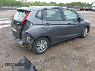 2015 Honda Fit LX z VIN 3HGGK5H59FM714352, wystawiony jako IAAI lot #42156097 z przebiegiem 103 587 mil mil oraz . Historia ofert i sprzedaży dostępna na DreamBid. Obrazek 4.