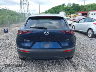 2021 Mazda CX-30 Premium z VIN 3MVDMBDL7MM236474, wystawiony jako IAAI lot #42284515 z przebiegiem 58 565 mil mil oraz . Historia ofert i sprzedaży dostępna na DreamBid. Obrazek 16.