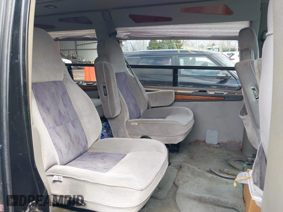 1999 Chevrolet Chevy Van z VIN 1GBFG15M0X1048842, wystawiony jako IAAI lot #41978139 z przebiegiem 188 274 mil mil oraz . Historia ofert i sprzedaży dostępna na DreamBid. Obrazek 8.