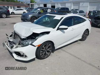 2018 Honda Civic Si with VIN 2HGFC1E53JH700251, listed as a IAAI auction lot 42043732 with 104,763 mi miles and . Bid and sale history available at DreamBid. Image 17.