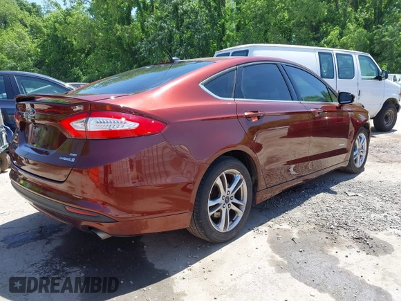 2016 Ford Fusion SE Hybrid with VIN 3FA6P0LU3GR143688, listed as a IAAI auction lot 42269789 with 163,910 mi miles and . Bid and sale history available at DreamBid. Image 4.