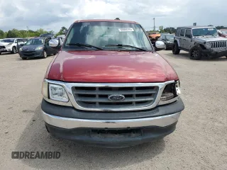2001 Ford F-150 XLT with VIN 1FTRW076X1KC42302, listed as a Copart auction lot 59868295 with 234,772 mi miles and Salvage title. Bid and sale history available at DreamBid. Image 5.