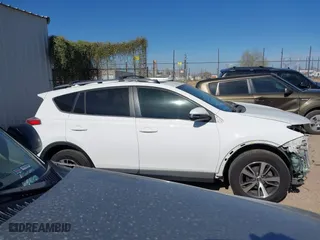 2017 Toyota RAV4 XLE with VIN JTMRFREV5HJ123412, listed as a IAAI auction lot 42018549 with 127,974 mi miles. Bid and sale history available at carsss.com. Image 14.