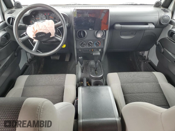 2007 Jeep Wrangler Unlimited X with VIN 1J4GA39117L169245, listed as a Copart auction lot 56731665 with 136,247 mi miles and Salvage title. Bid and sale history available at DreamBid. Image 8.