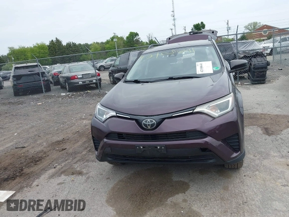 2018 Toyota RAV4 LE with VIN 2T3BFREV9JW771845, listed as a IAAI auction lot 42108641 with 127,394 mi miles. Bid and sale history available at carsss.com. Image 13.