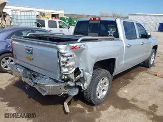 2014 Chevrolet Silverado 1500 LT with VIN 3GCUKREC3EG101975, listed as a IAAI auction lot 41868152 with 221,738 mi miles. Bid and sale history available at carsss.com. Image 4.