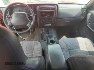 2000 Jeep Cherokee with VIN 1J4FF48S3YL257793, listed as a Copart auction lot 59932535 with 280,237 mi miles and Clean title. Bid and sale history available at DreamBid. Image 8.