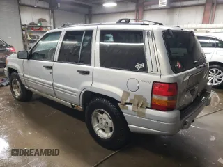 1998 Jeep Grand Cherokee Laredo with VIN 1J4GZ48S3WC269693, listed as a Copart auction lot 85026074 with 308,791 mi miles and Salvage Title. Bid and sale history available at carsss.com. Image 2.
