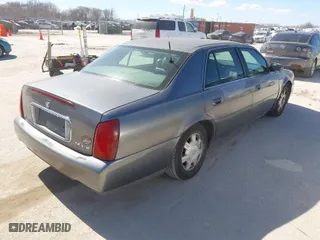 2003 Cadillac DeVille with VIN 1G6KD54Y13U173679, listed as a IAAI auction lot 41686383 with 106,054 mi miles. Bid and sale history available at carsss.com. Image 4.