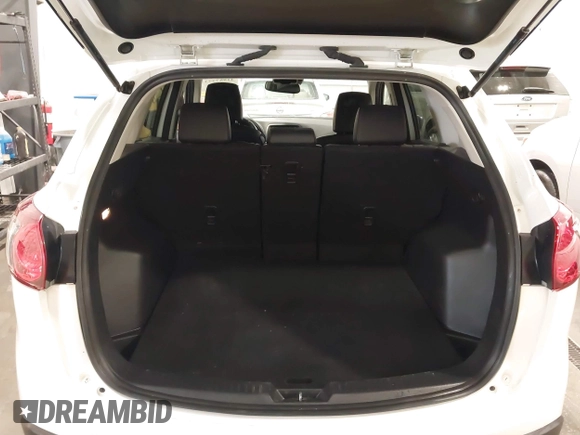 2015 Mazda CX-5 Grand Touring with VIN JM3KE4DY4F0495627, listed as a IAAI auction lot 41887773 with 130,421 mi miles. Bid and sale history available at carsss.com. Image 18.