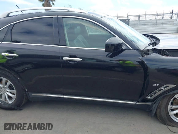 2014 Infiniti QX70 z VIN JN8CS1MW6EM410091, wystawiony jako IAAI lot #41896327 z przebiegiem 139 021 mil mil oraz . Historia ofert i sprzedaży dostępna na DreamBid. Obrazek 13.