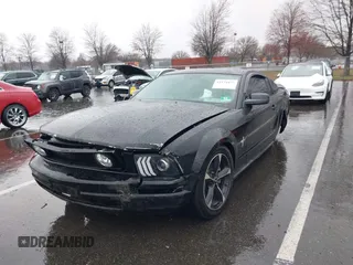 2007 Ford Mustang Deluxe with VIN 1ZVHT80N375320203, listed as a IAAI auction lot 41871055 with 80,891 mi miles. Bid and sale history available at carsss.com. Image 2.