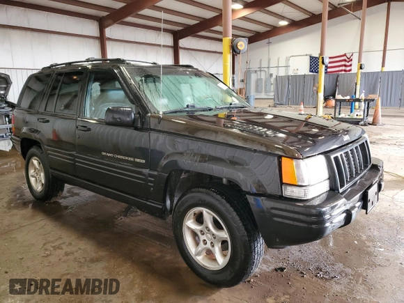 1998 Jeep Grand Cherokee Limited z VIN 1J4GZ88Z0WC276394, wystawiony jako Copart lot #46702355 z przebiegiem 144 232 mil mil oraz Szkoda całkowita • Salvage title. Historia ofert i sprzedaży dostępna na DreamBid. Obrazek 4.