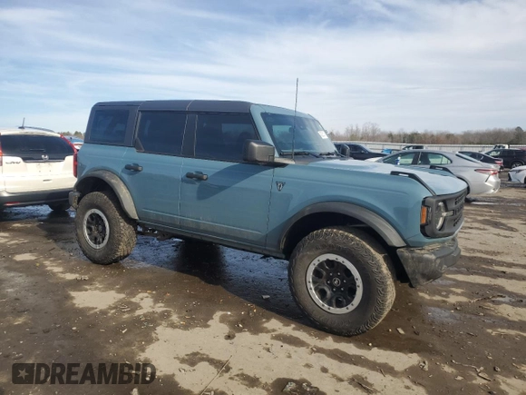 2023 Ford Bronco with VIN 1FMDE5DH1PLB25934, listed as a Copart auction lot 45305145 with 52,775 mi miles and Salvage Title. Bid and sale history available at DreamBid. Image 4.
