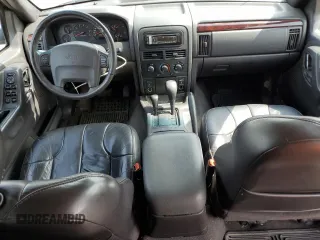 2000 Jeep Grand Cherokee Laredo with VIN 1J4GW48N1YC324356, listed as a Copart auction lot 62011305 with 242,322 mi miles and Salvage title. Bid and sale history available at DreamBid. Image 8.