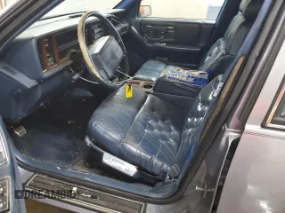 1991 Cadillac Seville z VIN 1G6KS53B2MU809384, wystawiony jako Copart lot #77185134 z przebiegiem 134 769 mil mil oraz Szkody całkowita. Historia ofert i sprzedaży dostępna na DreamBid. Obrazek 7.