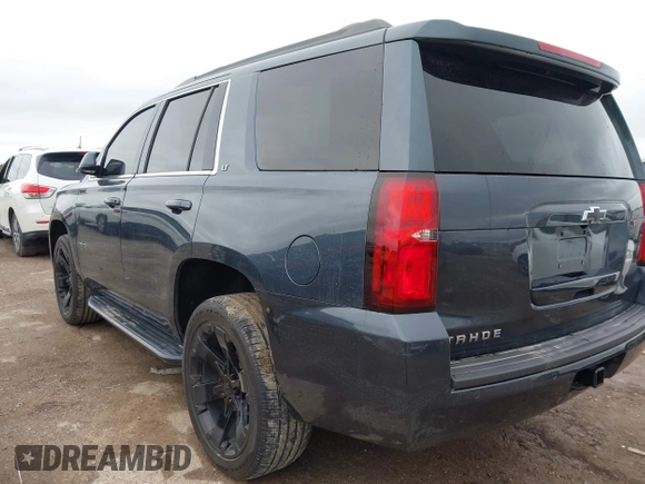 2020 Chevrolet Tahoe LT with VIN 1GNSKBKC3LR306946, listed as a IAAI auction lot 41570785 with 56,603 mi miles and . Bid and sale history available at DreamBid. Image 3.