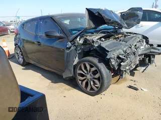 2013 Hyundai Veloster w/Red Int with VIN KMHTC6AD6DU091858, listed as a IAAI auction lot 42490419 with 162,323 mi miles and . Bid and sale history available at DreamBid. Image 1.