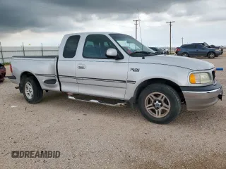 1999 Ford F-150 with VIN 1FTRX07W0XKB88434, listed as a Copart auction lot 60063135 with 277,188 mi miles and Salvage title. Bid and sale history available at DreamBid. Image 4.
