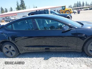 2022 Tesla Model 3 Long Range with VIN 5YJ3E1EB7NF241996, listed as a IAAI auction lot 42115915 with 23,433 mi miles and . Bid and sale history available at DreamBid. Image 13.