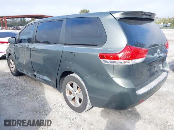 2014 Toyota Sienna L with VIN 5TDZK3DC6ES421278, listed as a IAAI auction lot 41178679 with 202,823 mi miles. Bid and sale history available at carsss.com. Image 3.