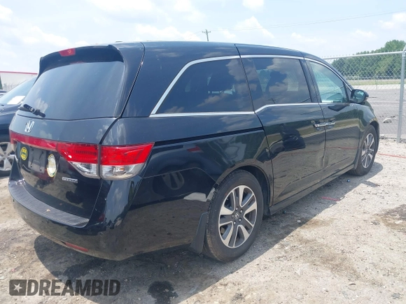 2015 Honda Odyssey Touring Elite with VIN 5FNRL5H90FB003506, listed as a IAAI auction lot 42585049 with 120,543 mi miles and . Bid and sale history available at DreamBid. Image 4.