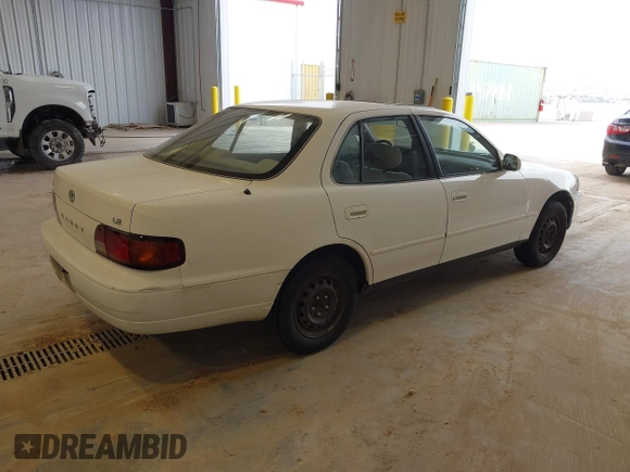 1996 Toyota Camry DX with VIN JT2BG12K3T0401659, listed as a IAAI auction lot 41874795 with 169,406 mi miles. Bid and sale history available at carsss.com. Image 4.
