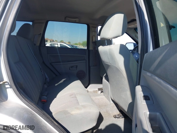 2005 Jeep Grand Cherokee Laredo with VIN 1J4HR48N45C628711, listed as a IAAI auction lot 42004501 with 147,047 mi miles. Bid and sale history available at carsss.com. Image 8.