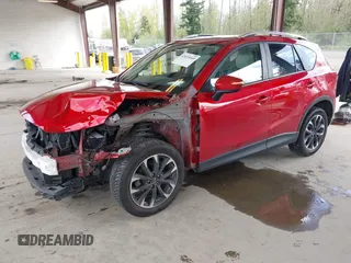 2016 Mazda CX-5 Grand Touring with VIN JM3KE4DY3G0688062, listed as a IAAI auction lot 42025169 with 59,867 mi miles and . Bid and sale history available at carsss.com. Image 18.