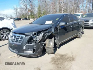 2013 Cadillac XTS Luxury z VIN 2G61R5S33D9184878, wystawiony jako IAAI lot #41644213 z przebiegiem 113 293 mil mil oraz . Historia ofert i sprzedaży dostępna na DreamBid. Obrazek 17.