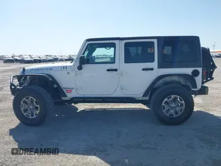 2014 Jeep Wrangler Unlimited Rubicon with VIN 1C4BJWFG1EL167423, listed as a IAAI auction lot 41861109 with 104,669 mi miles. Bid and sale history available at carsss.com. Image 14.