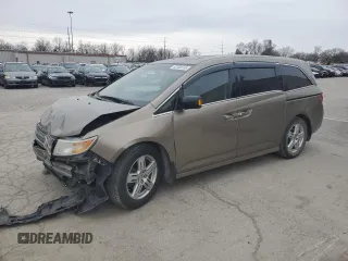 2012 Honda Odyssey Touring with VIN 5FNRL5H9XCB078399, listed as a Copart auction lot 52360165 with 174,819 mi miles and Salvage Title. Bid and sale history available at DreamBid. Image 1.
