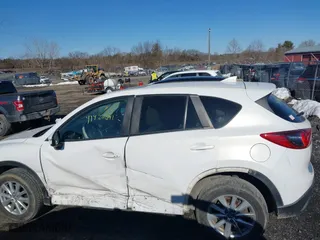 2016 Mazda CX-5 Touring with VIN JM3KE4CYXG0917841, listed as a IAAI auction lot 41420641 with 75,710 mi miles. Bid and sale history available at carsss.com. Image 14.